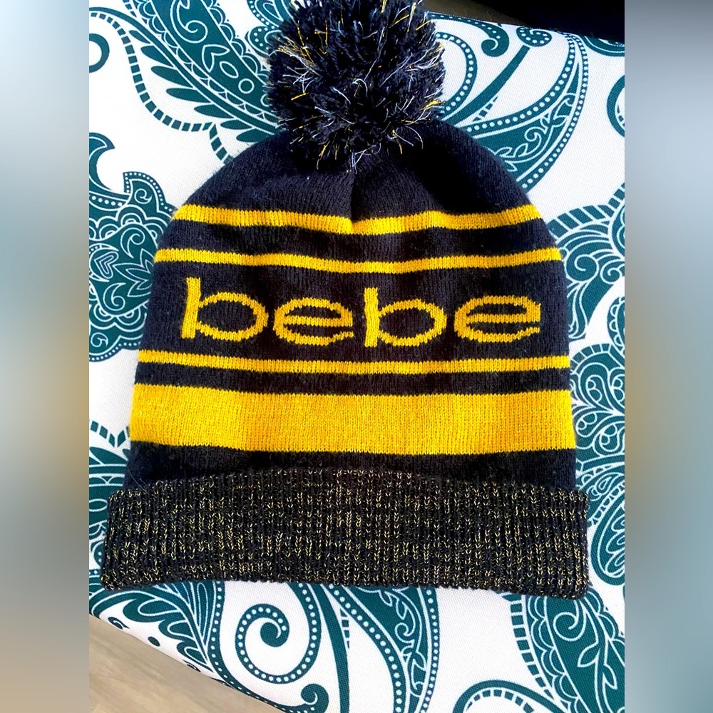 Bebe hat black and gold